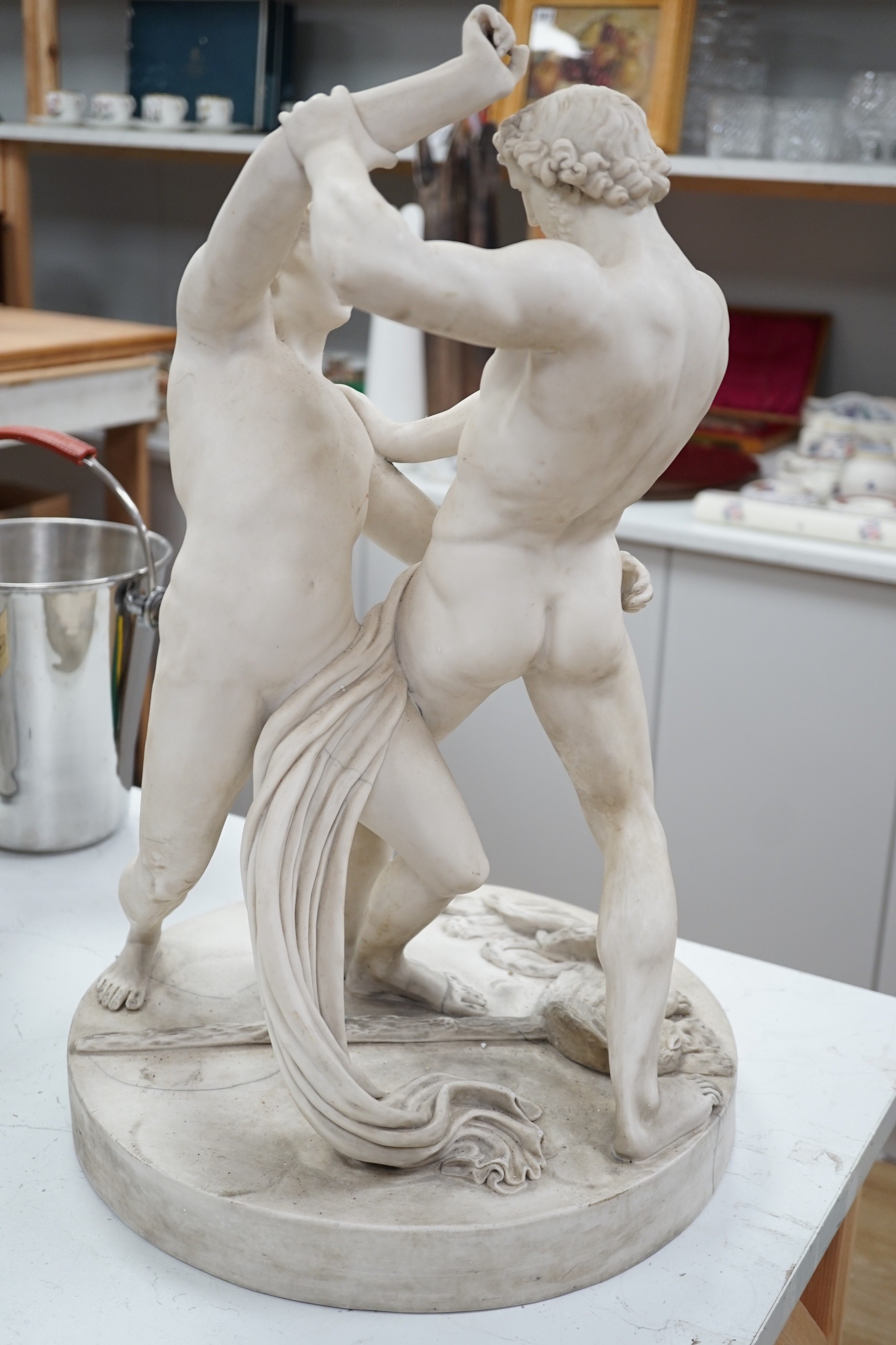 A large 19th century parian group of classical wrestlers (cracked). 55cm tall